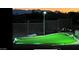 Backyard putting green is illuminated for evening enjoyment at 13729 E Rancho Laredo Dr, Scottsdale, AZ 85262