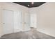 Relaxing bedroom with a ceiling fan, closet, and doorway to another room at 1434 W Brangus Way, San Tan Valley, AZ 85143