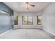 Bedroom with neutral walls, a ceiling fan, and several windows for ample natural light at 1434 W Brangus Way, San Tan Valley, AZ 85143