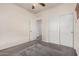 Comfortable bedroom showcases a doorway, built-in closet, and carpeted floors at 1434 W Brangus Way, San Tan Valley, AZ 85143