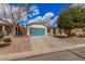 Beautiful single-story home with a blue garage door, desert landscaping, and inviting curb appeal at 1434 W Brangus Way, San Tan Valley, AZ 85143