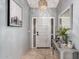 Welcoming foyer featuring neutral tones, tiled floor, and a decorative lighting fixture at 14402 N Silverado Dr, Fountain Hills, AZ 85268