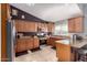 Well-appointed kitchen featuring wood cabinetry, stainless steel appliances, and countertop space at 14402 N Silverado Dr, Fountain Hills, AZ 85268