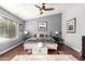 Charming main bedroom featuring a ceiling fan, wood floors, and stylish decor at 14402 N Silverado Dr, Fountain Hills, AZ 85268