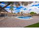 The backyard oasis offers a private pool, ample seating, and lush landscaping for ultimate relaxation and enjoyment at 14609 W Marcus Dr, Surprise, AZ 85374