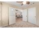 Bedroom with view to vaulted ceiling living room; the sliding doors allow light into both rooms at 14609 W Marcus Dr, Surprise, AZ 85374