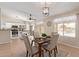 Inviting dining area adjacent to the kitchen, featuring stylish furnishings and natural light at 14609 W Marcus Dr, Surprise, AZ 85374