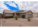 Single-story home with desert landscaping, a two-car garage, paved driveway, and neutral paint at 14609 W Marcus Dr, Surprise, AZ 85374