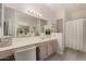 Bathroom featuring a large mirror, vanity with drawers, and a standing shower at 15050 N Thompson Peak Pkwy # 1006, Scottsdale, AZ 85260