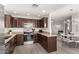 Functional kitchen with a view of the dining and living areas, fostering an open and inviting space at 15050 N Thompson Peak Pkwy # 1006, Scottsdale, AZ 85260