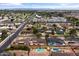 An aerial view showcases a vibrant community with well-maintained homes and inviting swimming pools at 1509 W Tuckey Ln, Phoenix, AZ 85015