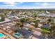 An aerial view of the neighborhood showcases lush greenery, charming homes, and community amenities at 1509 W Tuckey Ln, Phoenix, AZ 85015