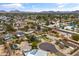 The aerial view of the neighborhood shows well-manicured yards, beautiful homes, and inviting community pools at 1509 W Tuckey Ln, Phoenix, AZ 85015