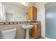 Bathroom featuring vanity with sink, decorative tiling, and glass enclosed shower stall at 1509 W Tuckey Ln, Phoenix, AZ 85015