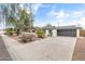 Charming single-story home featuring a spacious driveway, mature trees, and a well-maintained landscape at 1509 W Tuckey Ln, Phoenix, AZ 85015