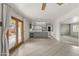 Open concept living room and kitchen with modern lighting fixture at 1509 W Tuckey Ln, Phoenix, AZ 85015