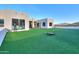 Expansive backyard with artificial turf perfect for outdoor activities and entertaining with mountain views at 15574 N Brielles Way, Maricopa, AZ 85139