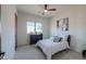 Bedroom with natural light, neutral colors, and a ceiling fan at 15574 N Brielles Way, Maricopa, AZ 85139