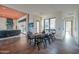 Elegant dining area with modern table, views of the backyard and living area at 15574 N Brielles Way, Maricopa, AZ 85139