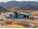 Striking desert home boasts modern architecture and a circular driveway at 15574 N Brielles Way, Maricopa, AZ 85139