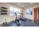 Home gym with exercise equipment, natural light, and mountain views at 15574 N Brielles Way, Maricopa, AZ 85139