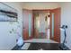 Hallway view, showcasing contemporary design with stone accent wall and sleek door frames, leading to other rooms at 15574 N Brielles Way, Maricopa, AZ 85139