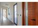 Hallway with contemporary door and window design and concrete flooring leading to a bright living space at 15574 N Brielles Way, Maricopa, AZ 85139