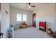 Spacious playroom with natural light, neutral colors, and wood door at 15574 N Brielles Way, Maricopa, AZ 85139