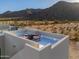 Rooftop deck with a view of the desert mountains features a sleek, modern design and stylish patio seating at 15574 N Brielles Way, Maricopa, AZ 85139