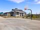 Community basketball court with a hoop, backboard, and recreational building nearby at 16013 W Desert Hollow Dr, Surprise, AZ 85387