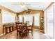 Cozy dining area with decorative accents, a ceiling fan, and ample natural light from the windows at 17200 W Bell Rd # 866, Surprise, AZ 85374