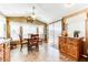 Bright dining area featuring neutral walls, tile floors, and natural light from large windows and doors at 17200 W Bell Rd # 866, Surprise, AZ 85374