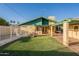 Lovely backyard view with lush lawn and covered patio, perfect for outdoor living and relaxation at 1721 W Weldon Ave, Phoenix, AZ 85015