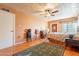 Cozy bedroom with hardwood floors, ceiling fan, and a vintage-style rug at 1721 W Weldon Ave, Phoenix, AZ 85015