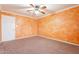 Bedroom featuring vibrant textured walls, neutral carpet, and a white paneled door at 1721 W Weldon Ave, Phoenix, AZ 85015