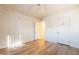 Sunlit bedroom with modern flooring and white doors, creating a bright and airy feel at 1721 W Weldon Ave, Phoenix, AZ 85015