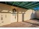 Covered outdoor patio and door with decorative wreath and green-painted accents at 1721 W Weldon Ave, Phoenix, AZ 85015