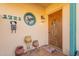 Covered entryway with flower-shaped stained glass and wood door at 1722 at 1721 W Weldon Ave, Phoenix, AZ 85015