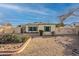 Desert landscaping compliments this single story home with painted exterior walls at 1721 W Weldon Ave, Phoenix, AZ 85015