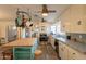 A vintage kitchen with a center island, stainless steel appliances, and tile countertops at 1721 W Weldon Ave, Phoenix, AZ 85015