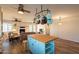 Open-concept kitchen with a butcher block island, adjacent living room, and stainless appliances at 1721 W Weldon Ave, Phoenix, AZ 85015