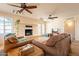 A beautiful open living space with lots of seating, a fireplace, and natural lighting from the windows at 1721 W Weldon Ave, Phoenix, AZ 85015