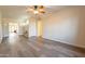 Open-concept living room features wood-look floors, neutral walls, and traditional trim at 1721 W Weldon Ave, Phoenix, AZ 85015