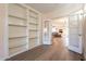 Living room or office space featuring a built-in bookcase and French doors at 1721 W Weldon Ave, Phoenix, AZ 85015