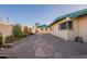 The side yard shows a well-kept stone pathway and subtle landscaping, creating a peaceful outdoor transition at 1721 W Weldon Ave, Phoenix, AZ 85015