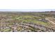 Aerial view of the residential area with houses and a golf course in a beautiful community at 17751 W Desert View Ln, Goodyear, AZ 85338