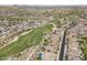 Aerial view of homes surrounding the golf course with views of the desert landscape in the community at 17751 W Desert View Ln, Goodyear, AZ 85338