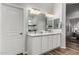 Modern bathroom featuring double sinks, granite counters, and plenty of vanity storage space at 17751 W Desert View Ln, Goodyear, AZ 85338