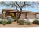 Charming single-story home with a well-maintained desert landscape and a three car garage at 17751 W Desert View Ln, Goodyear, AZ 85338