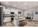 Bright kitchen featuring stainless steel appliances, granite counters, island, and breakfast nook at 17751 W Desert View Ln, Goodyear, AZ 85338